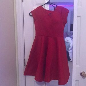 I’m selling this ruby red dress